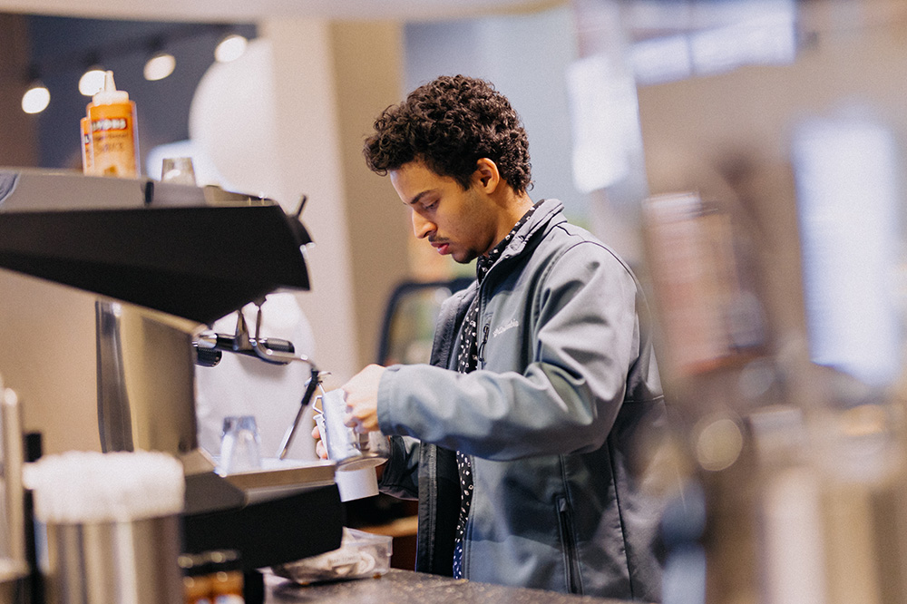 Man making a hot coffee